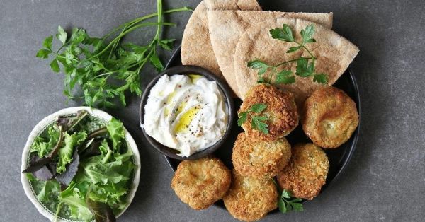 photo shows falafel balls with yoghurt dip