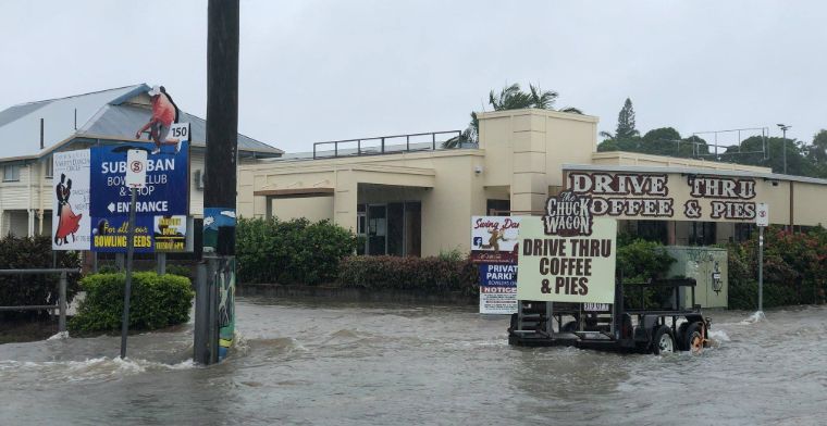Floodwaters have inundated homes, streets, and shopping areas.