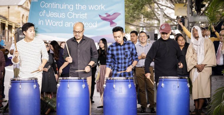 Four men playing drums at palm sunday service